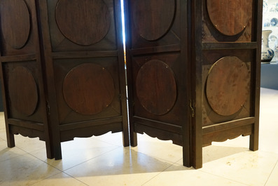 A Chinese wooden room divider with blue and white 'dragon' plaques, 19th C.