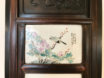 Une armoire en bois sculpt&eacute; orn&eacute;e de 23 plaques en porcelaine de Chine qianjiang cai, 19/20&egrave;me