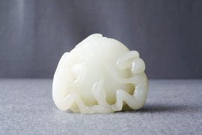 A Chinese celadon jade carving of two monkeys on a peach, 19th C.