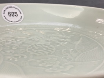 A Chinese celadon saucer dish with underglaze design, Yongzheng mark and poss. of the period
