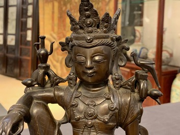 A Chinese silver-inlaid bronze figure of Guanyin on a dragon, Shisou mark, 18/19th C.
