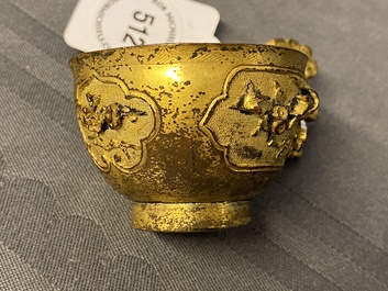 A Chinese relief-decorated gilt bronze cup, Ming