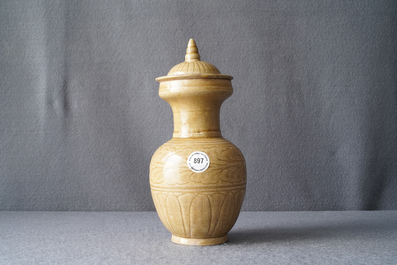 A Chinese brown-glazed vase and cover with incised design, Song