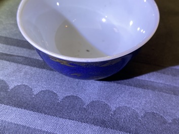 A Chinese gilt-decorated powder blue cream jug, a tea caddy and a tea bowl with roosters, Yongzheng