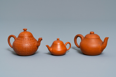 Three Chinese Yixing stoneware teapots and covers, impressed marks, 18/19th C.