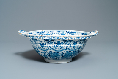 A large Dutch Delft blue and white two-handled chinoiserie bowl, 18th C.