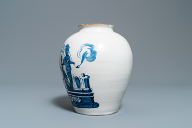 A Dutch Delft blue and white tobacco jar with American Indians and inscribed 'Tonka', 18th C.