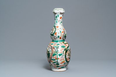 A Chinese famille verte relief-moulded double gourd 'dragon' vase on wooden stand, 19/20th C.