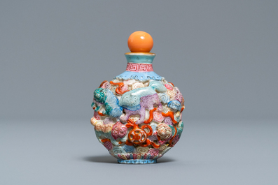 A Chinese famille rose moulded 'Buddhist lions' snuff bottle, Qianlong mark, 19th C.