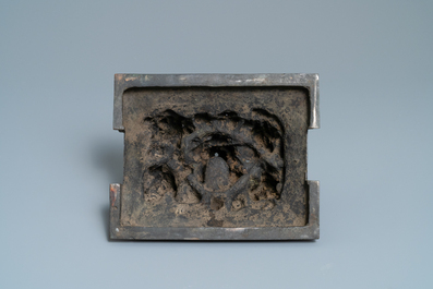 A large Chinese bronze censer and cover with animals near a hilly landscape, Ming