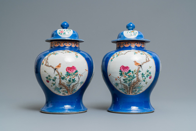 A pair of Chinese famille rose vases and covers, Qianlong mark, 19th C.