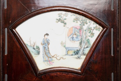 A Chinese wooden room divider with famille rose 'Romance of the Western Chamber' plaques, Republic