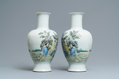 A pair of Chinese famille rose vases with go-players, Qianlong mark, 19/20th C.