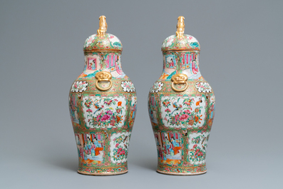 A pair of Chinese Canton famille rose vases and covers, 19th C.