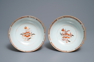 Three Chinese iron red and gilt plates and two bowls, Kangxi/Yongzheng