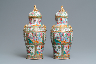 A pair of Chinese Canton famille rose vases and covers, 19th C.