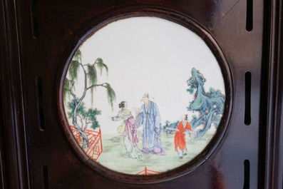 A Chinese wooden room divider with famille rose 'Romance of the Western Chamber' plaques, Republic