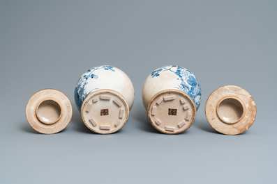 A pair of Chinese blue and white Nanking crackle-glazed vases and covers, 19th C.