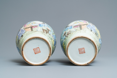 A pair of Chinese famille rose vases with go-players, Qianlong mark, 19/20th C.