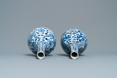 A pair of Chinese blue and white bottle vases with dragons, 19th C.