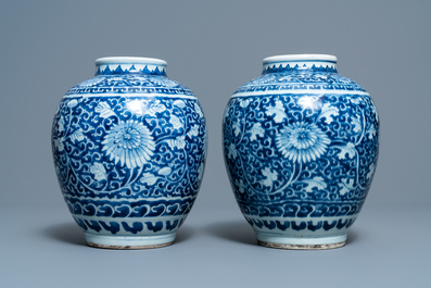 A pair of Chinese blue and white vases with floral design, Kangxi