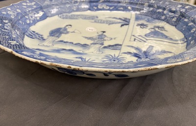 A large Chinese blue and white 'Romance of the Western chamber' dish, Qianlong