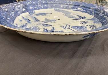 A large Chinese blue and white 'Romance of the Western chamber' dish, Qianlong