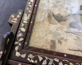 A Chinese mother-of-pearl-inlaid wooden screen with silk embroidery, 19th C.