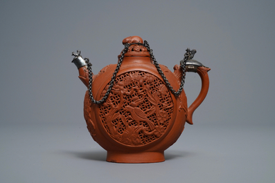 Een Chinese dubbelwandige opengewerkte Yixing steengoed theepot met zilveren montuur, Kangxi