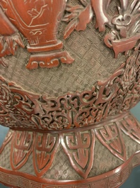 A Chinese carved cinnabar lacquer vase, Qianlong mark, 19/20th C.