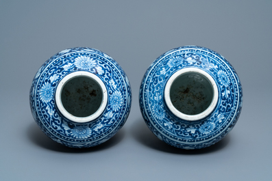 A pair of Chinese blue and white vases with floral design, Kangxi