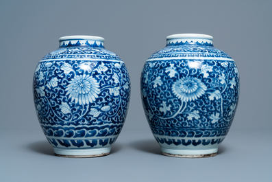 A pair of Chinese blue and white vases with floral design, Kangxi