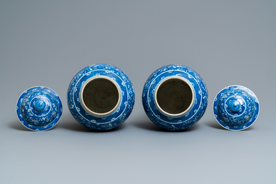 Two pairs of Chinese blue and white vases and covers, 19/20th C.