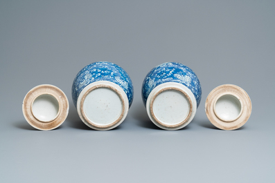 Two pairs of Chinese blue and white vases and covers, 19/20th C.