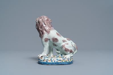 A polychrome Brussels or Lille faience model of a lion, late 18th C.