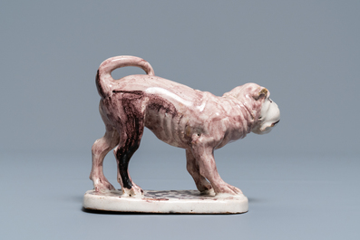 A manganese Lille faience model of a monkey, late 18th C.