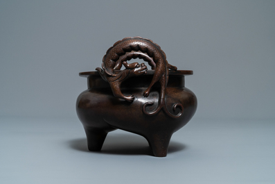 A Chinese bronze chilong-handled tripod censer, seal mark, 17/18th C.