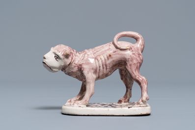 A manganese Lille faience model of a monkey, late 18th C.