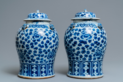 Two pairs of Chinese blue and white vases and covers, 19/20th C.