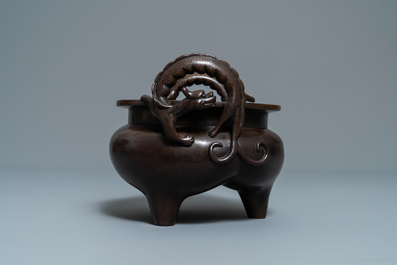 A Chinese bronze chilong-handled tripod censer, seal mark, 17/18th C.