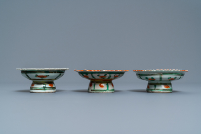 A Chinese famille rose teapot, a covered bowl and three Bencharong bowls on stand, 19th C.