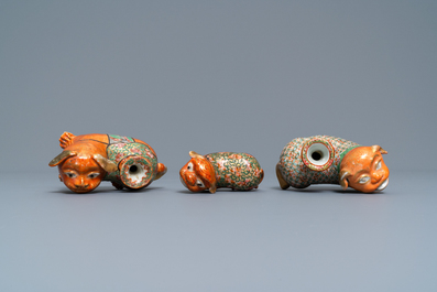 Three Chinese Canton famille rose models of dogs, two with candle holders, 19th C.