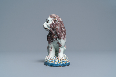 A polychrome Brussels or Lille faience model of a lion, late 18th C.