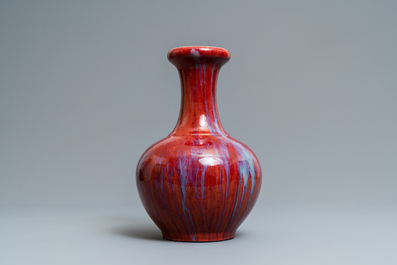 A Chinese monochrome flamb&eacute; sang-de-boeuf bottle vase, 19th C.