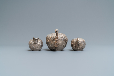 A Chinese silver teapot, cream jug and sugar jar, marked Luen Wo - Shanghai, late 19th C.