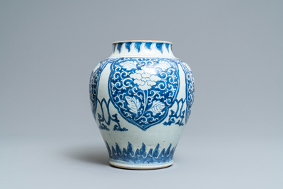 A Chinese blue and white vase with floral panels, Kangxi