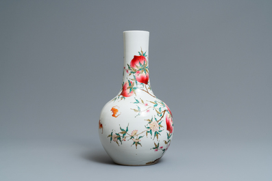 A Chinese famille rose 'nine peaches' bottle vase, Guangxu mark, 19/20th C.