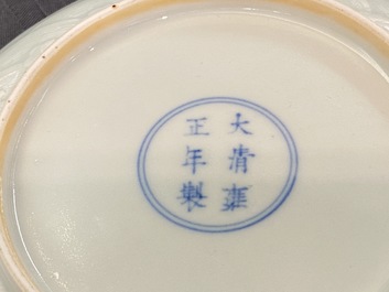 A Chinese celadon saucer dish with underglaze design, Yongzheng mark and poss. of the period