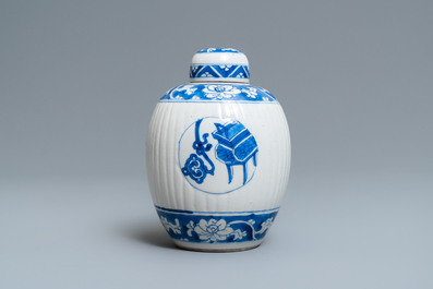 A Chinese ribbed blue and white jar and cover, Kangxi