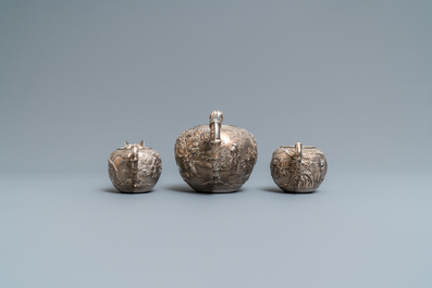 A Chinese silver teapot, cream jug and sugar jar, marked Luen Wo - Shanghai, late 19th C.